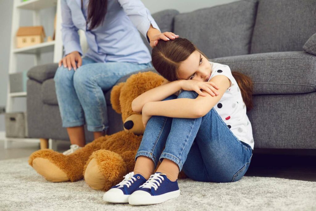 Worried child on the living room floor