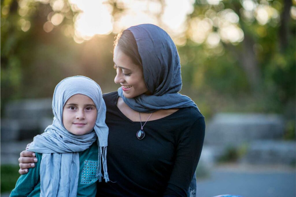 Our vision - a girl and mother smiling at camera